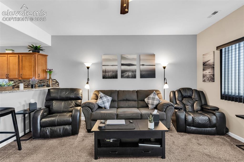 415 Empire Road Canon City, CO 81212 - Photo 9 of 40 a living room with furniture and a view of kitchen