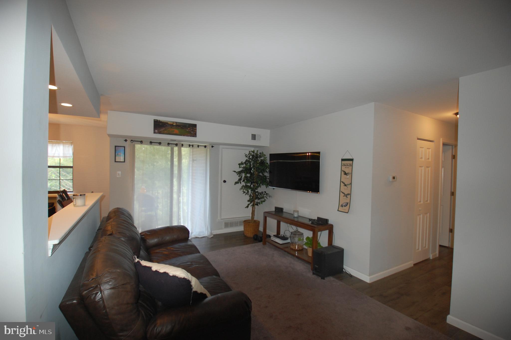 2220 Eagle Road West Chester, PA 19382 - Photo 10 of 25 Large living room with access to a private patio