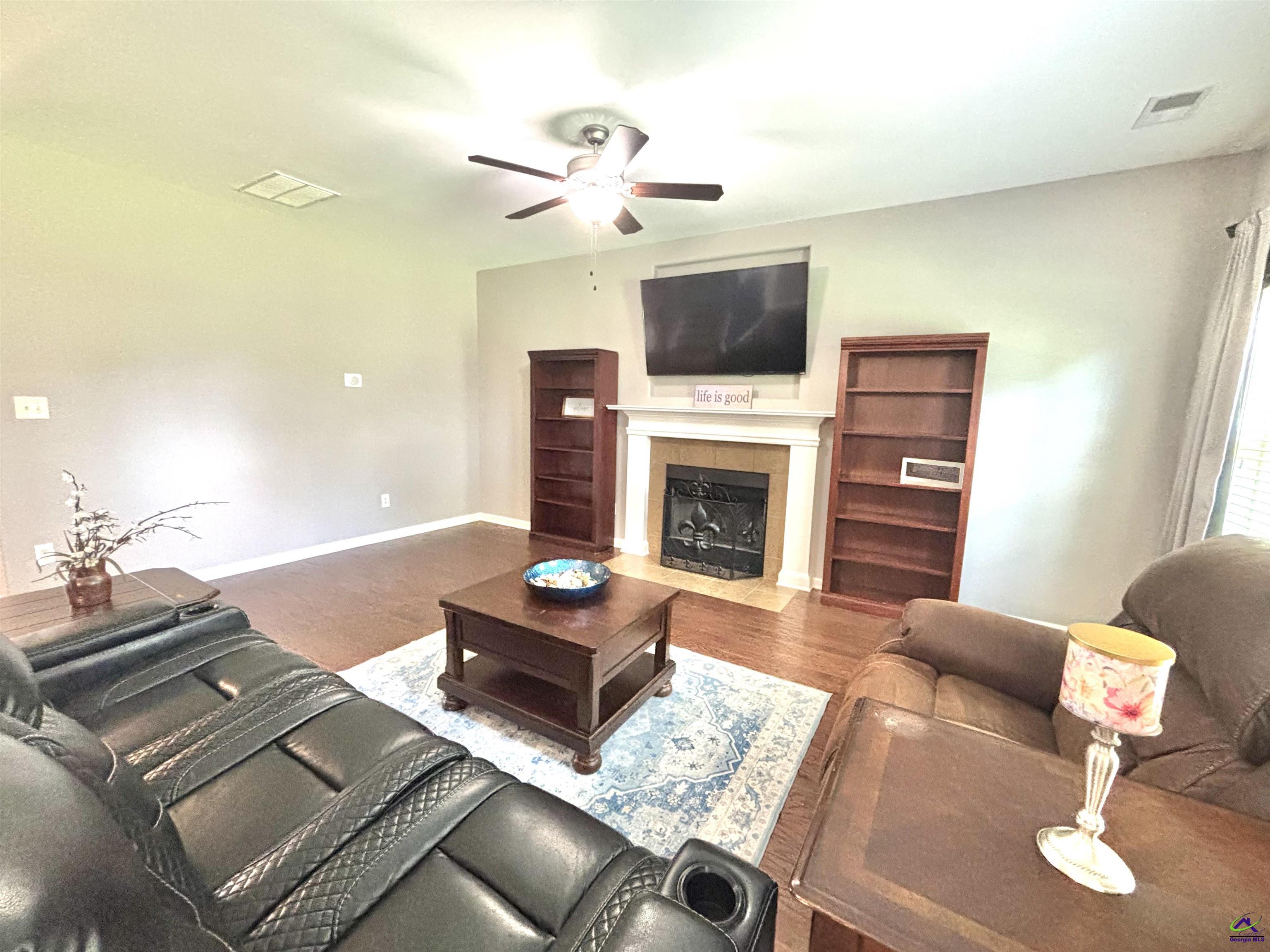 600 Post Oak Way Warner Robins, GA 31088 - Photo 14 of 50 a living room with furniture and a fireplace