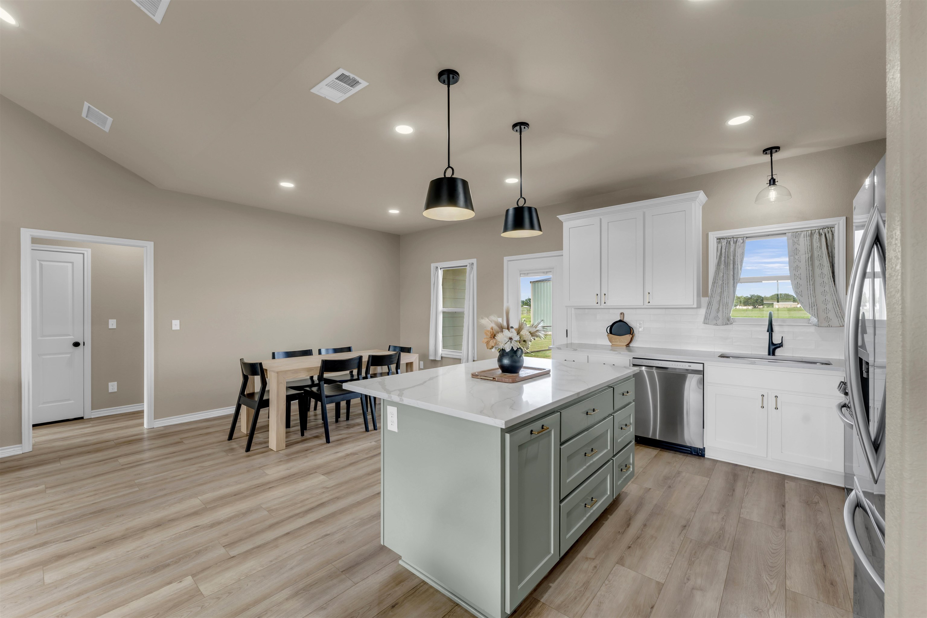 494 Johnson Road Mason, TX 76856 - Photo 6 of 28 a kitchen with a sink stove and wooden floor