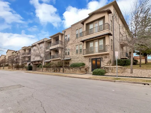 a front view of a building with a street