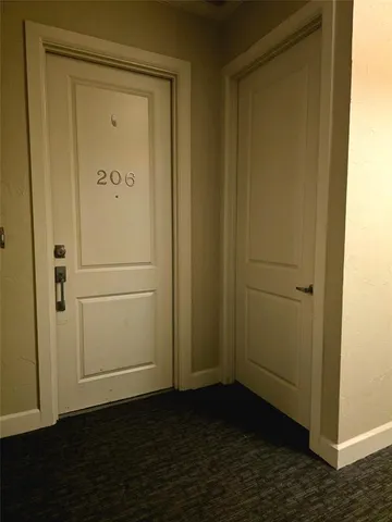 a view of door with wooden floor