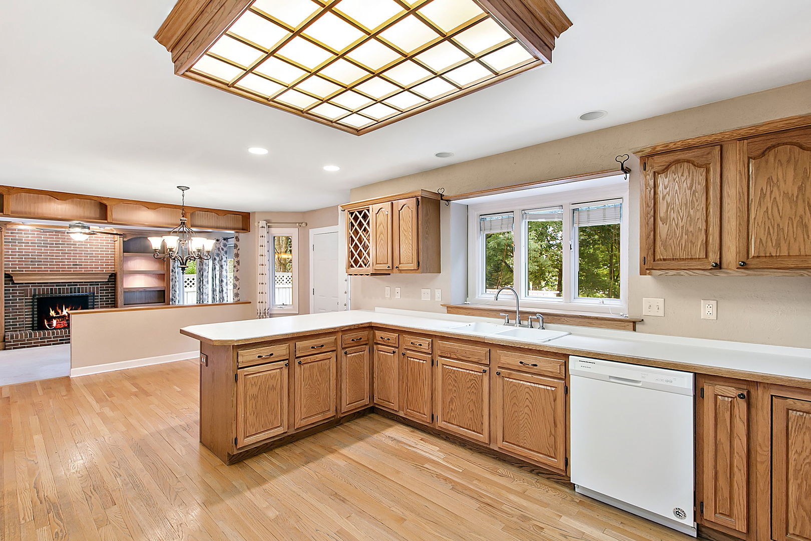 920 Merrill New Road Sugar Grove, IL 60554 - Photo 6 of 18 a large white kitchen with a large window