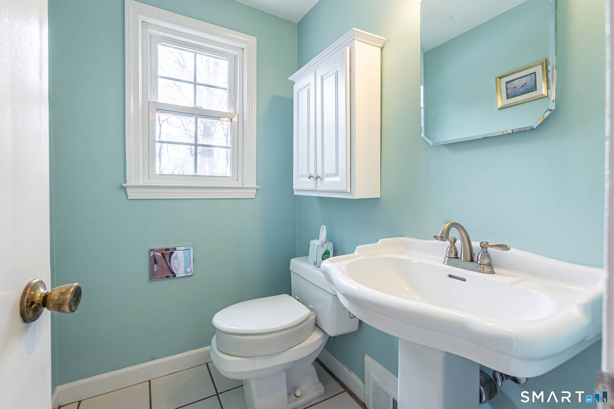 5 Lawler Road West Hartford, CT 06117 - Photo 11 of 33 a bathroom with a sink a toilet and a mirror