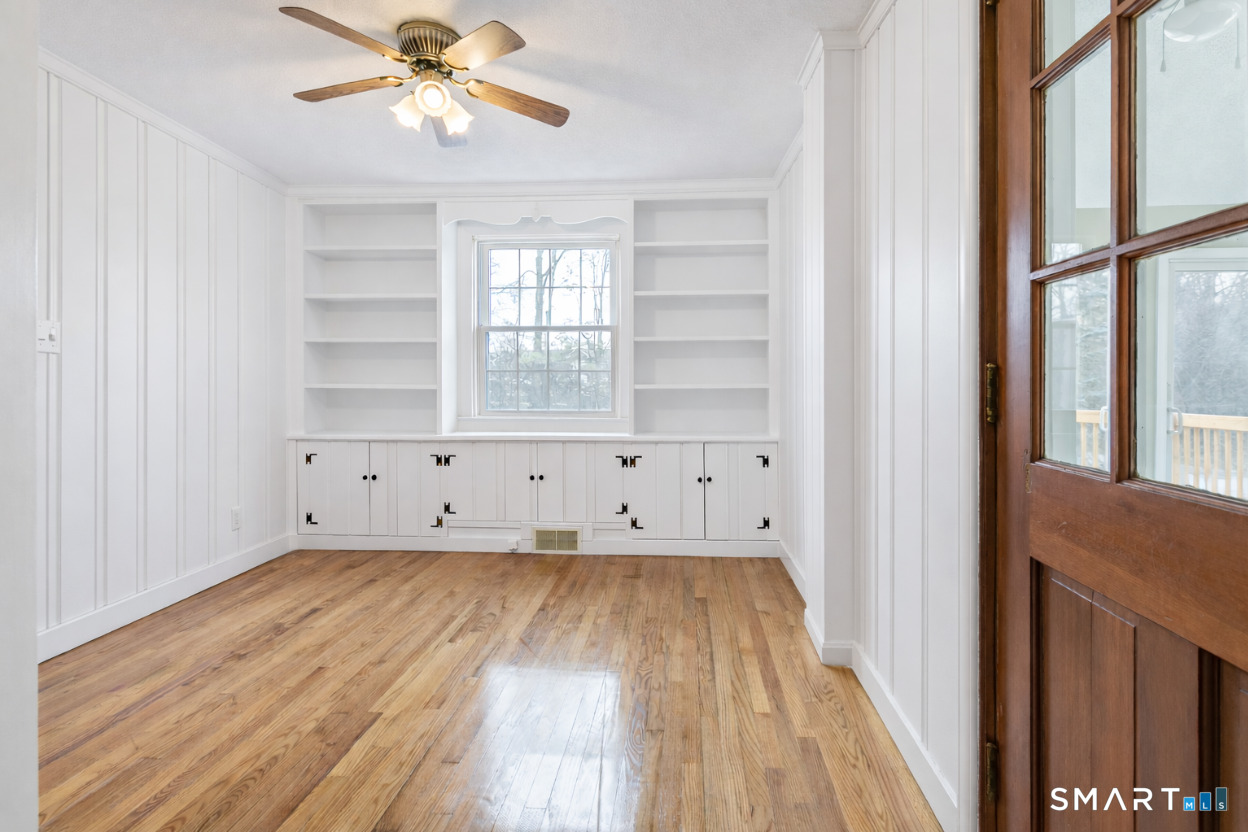 5 Lawler Road West Hartford, CT 06117 - Photo 12 of 33 a view of an empty room with wooden floor and a window