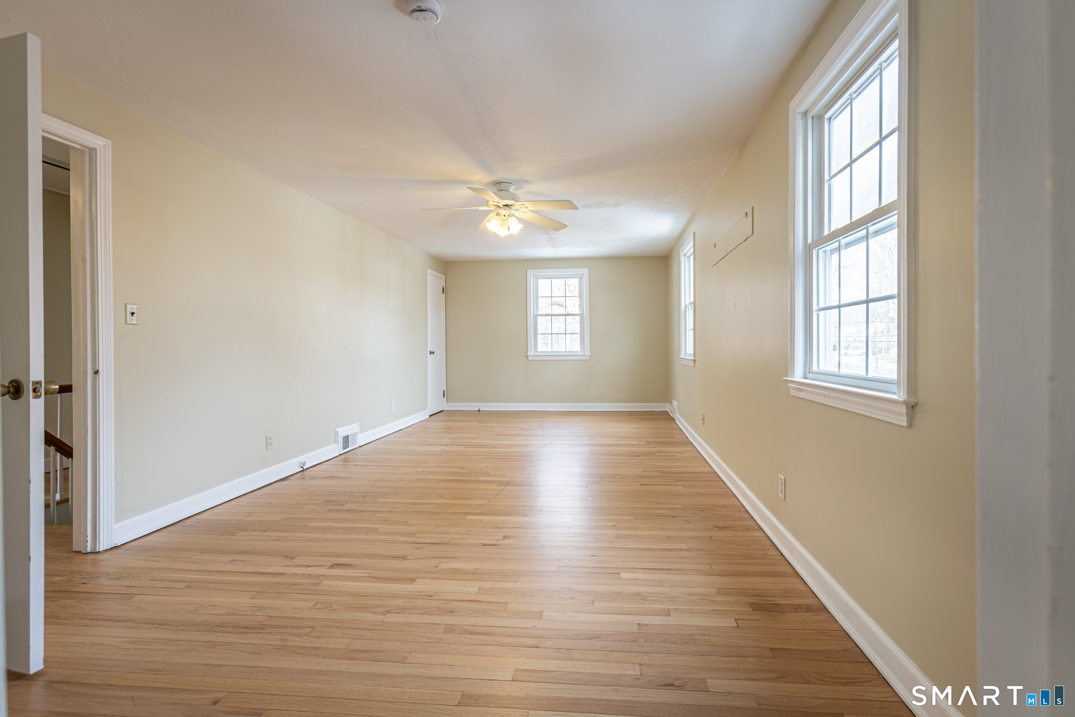 5 Lawler Road West Hartford, CT 06117 - Photo 18 of 33 a view of an empty room with wooden floor and a window