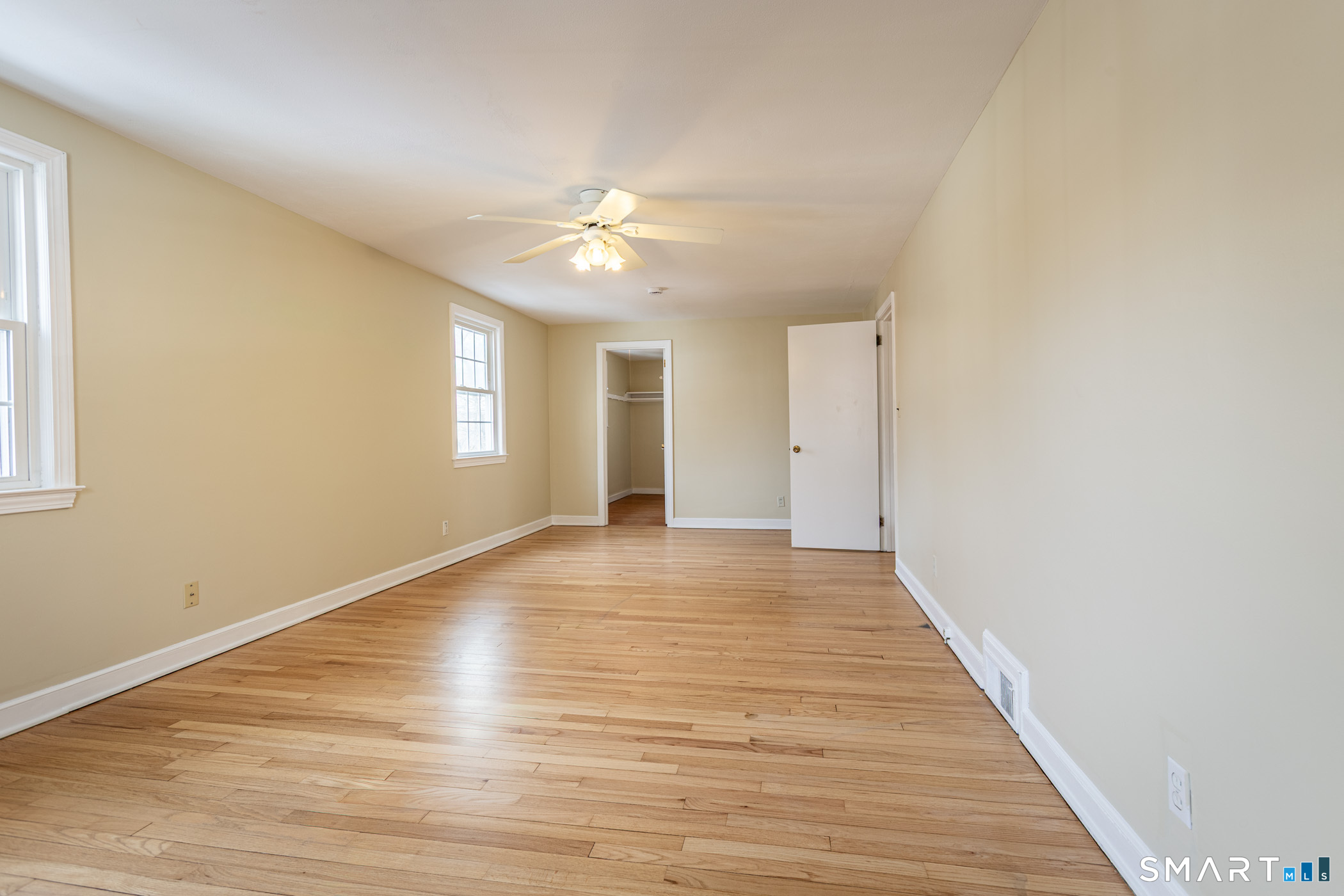 5 Lawler Road West Hartford, CT 06117 - Photo 19 of 33 a view of empty room with wooden floor and fan