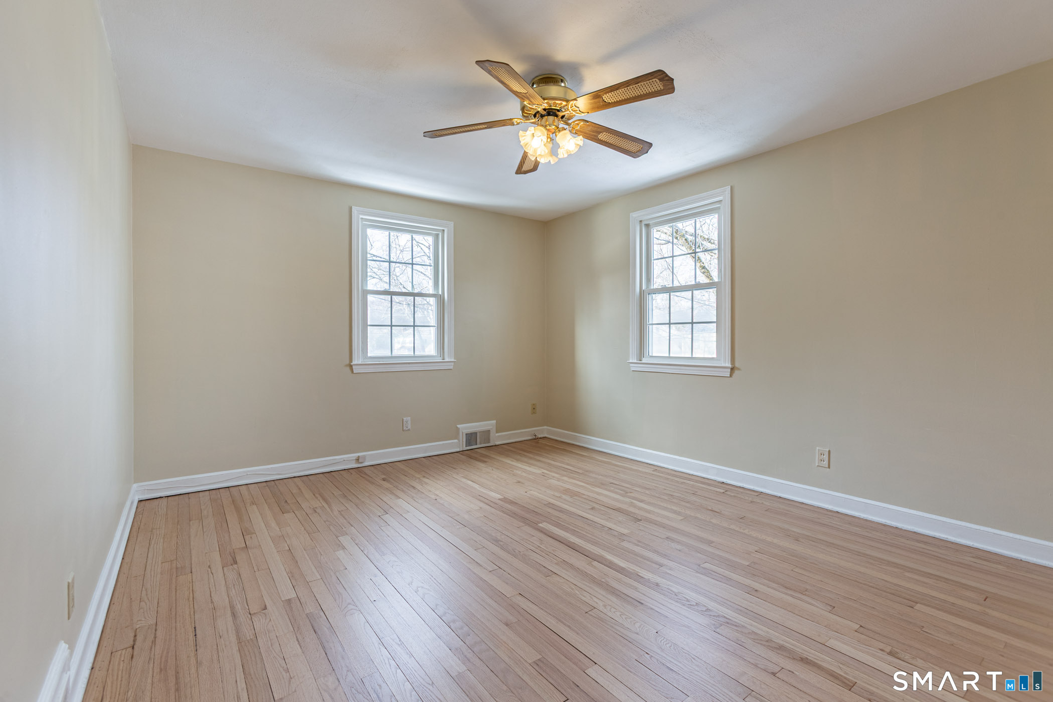 5 Lawler Road West Hartford, CT 06117 - Photo 24 of 33 an empty room with wooden floor and windows