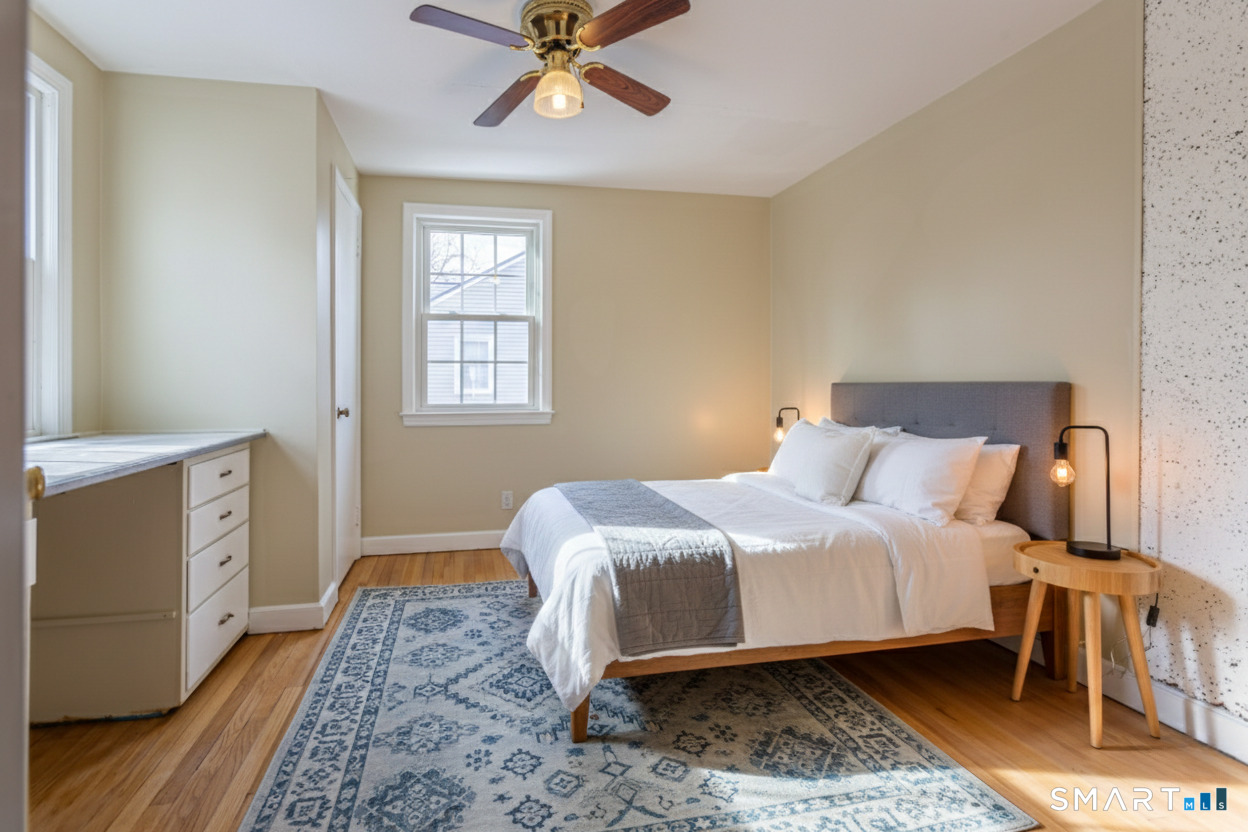 5 Lawler Road West Hartford, CT 06117 - Photo 25 of 33 a bedroom with a bed and a window