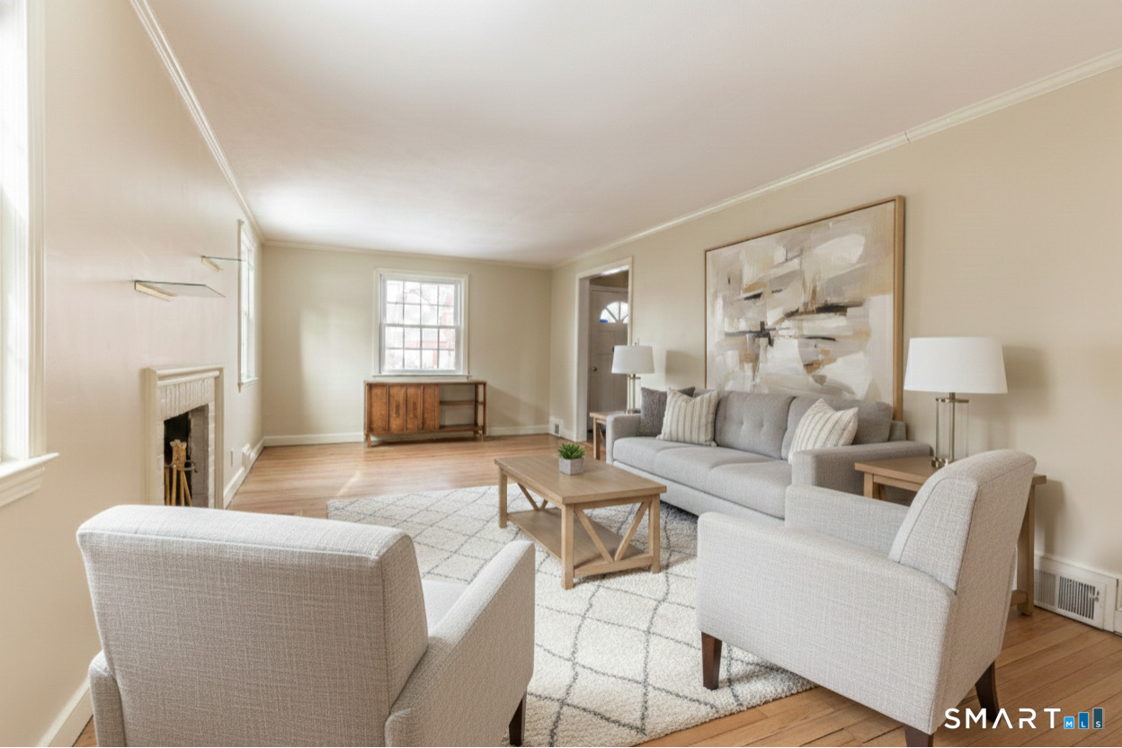 5 Lawler Road West Hartford, CT 06117 - Photo 3 of 33 a living room with furniture and a fireplace