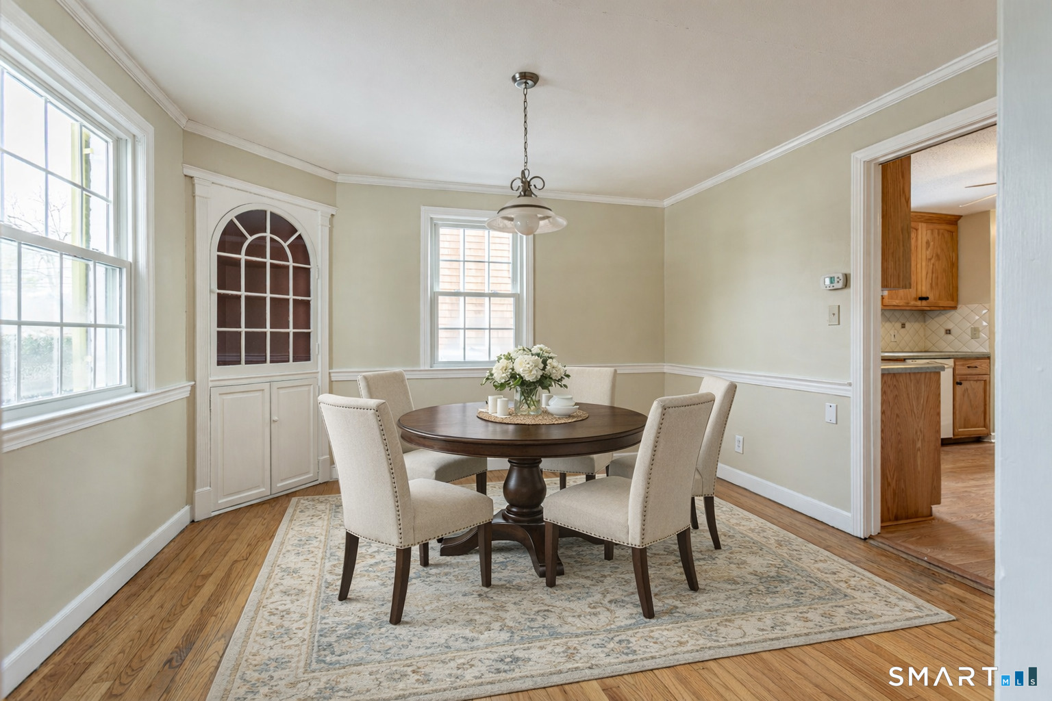 5 Lawler Road West Hartford, CT 06117 - Photo 7 of 33 a view of a dining room with furniture window and wooden floor