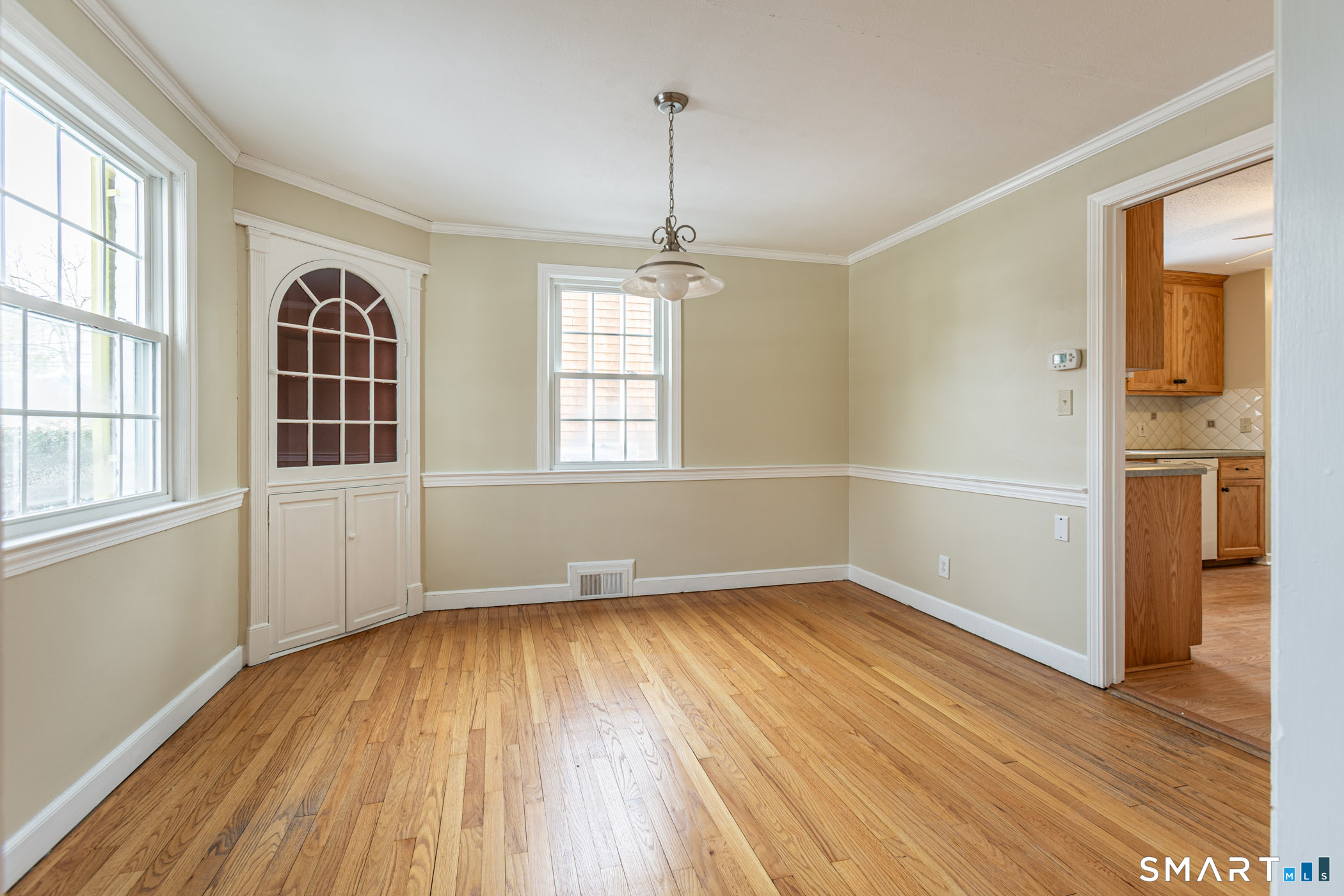 5 Lawler Road West Hartford, CT 06117 - Photo 8 of 33 wooden floor in an empty room with a window