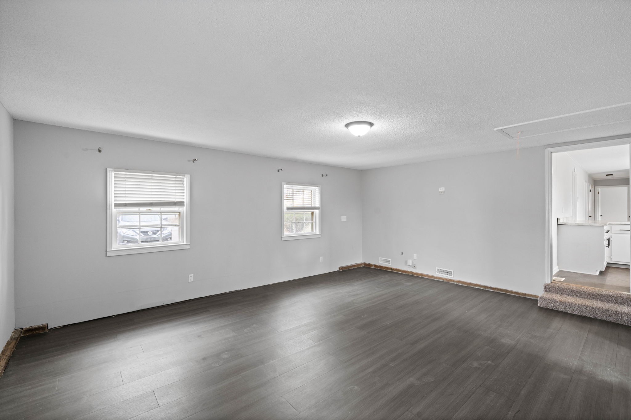 234 Old Trenton Road Clarksville, TN 37040 - Photo 14 of 25 an empty room with wooden floor and windows