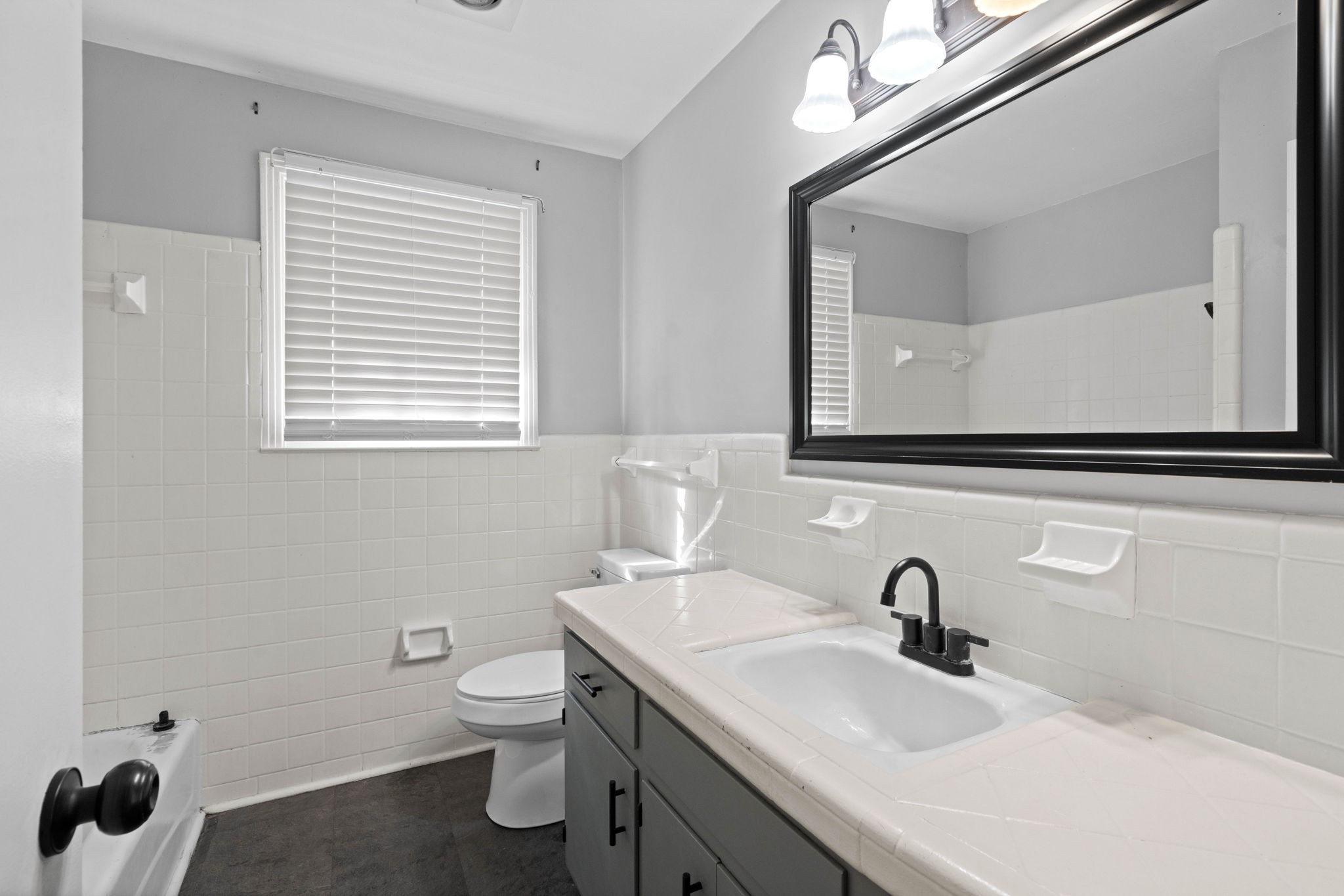 234 Old Trenton Road Clarksville, TN 37040 - Photo 18 of 25 a bathroom with a toilet a sink and mirror