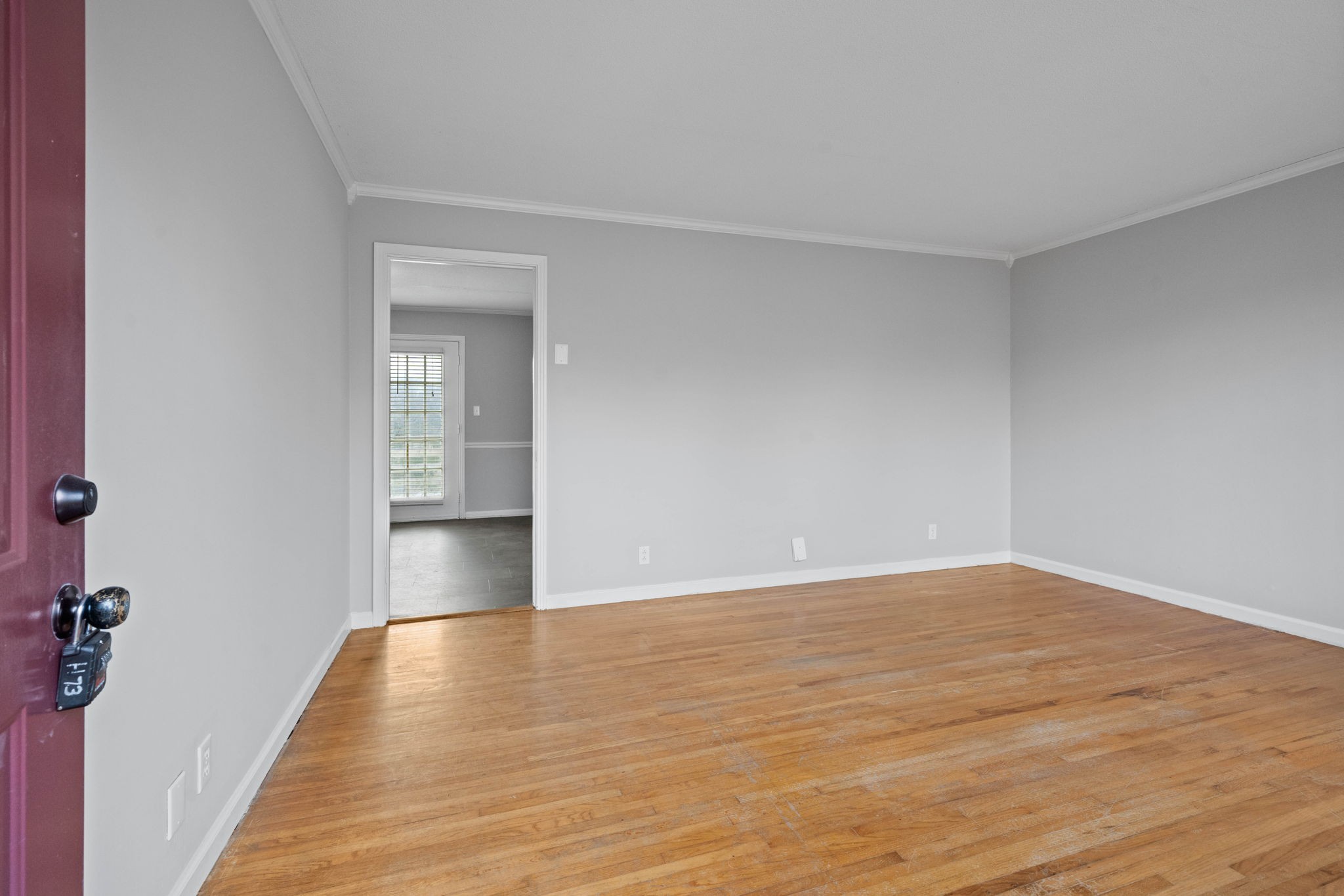 234 Old Trenton Road Clarksville, TN 37040 - Photo 4 of 25 a view of an empty room with wooden floor and a window