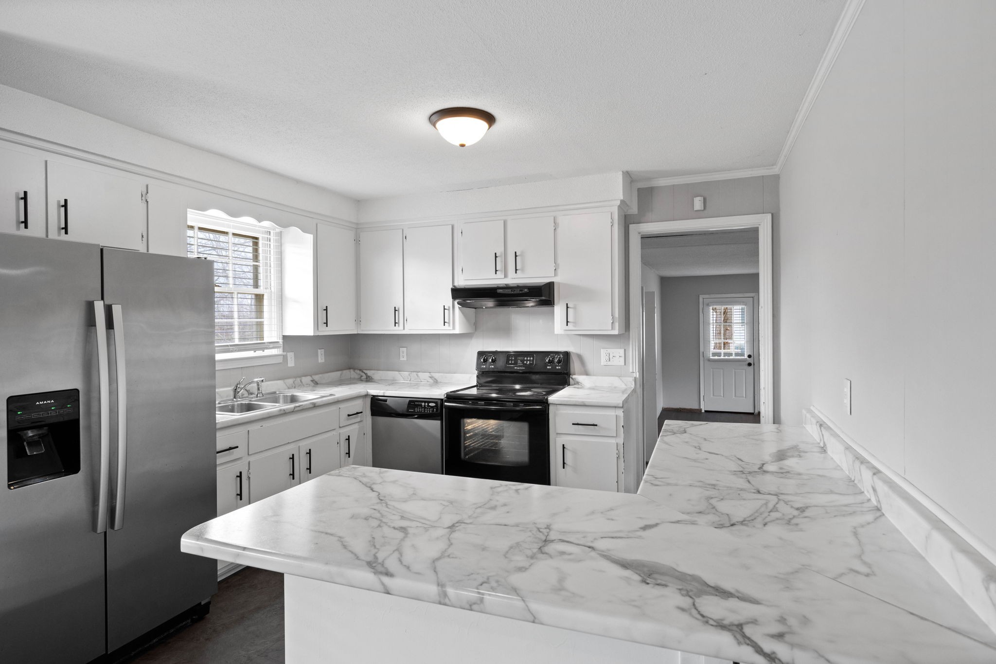 234 Old Trenton Road Clarksville, TN 37040 - Photo 8 of 25 a kitchen with granite countertop a sink stove and refrigerator