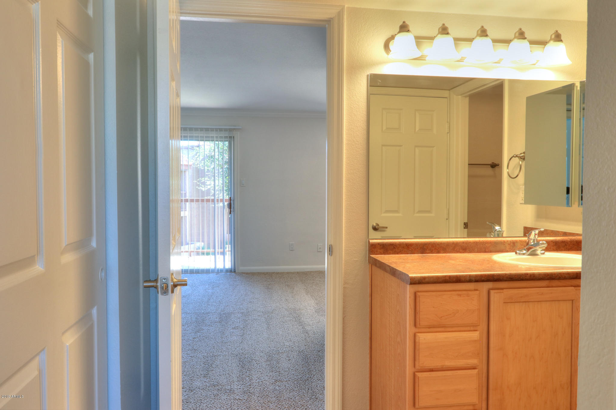 8256 East Arabian Trail, Unit 237 Scottsdale, AZ 85258 - Photo 17 of 31 a bathroom with a sink and a mirror