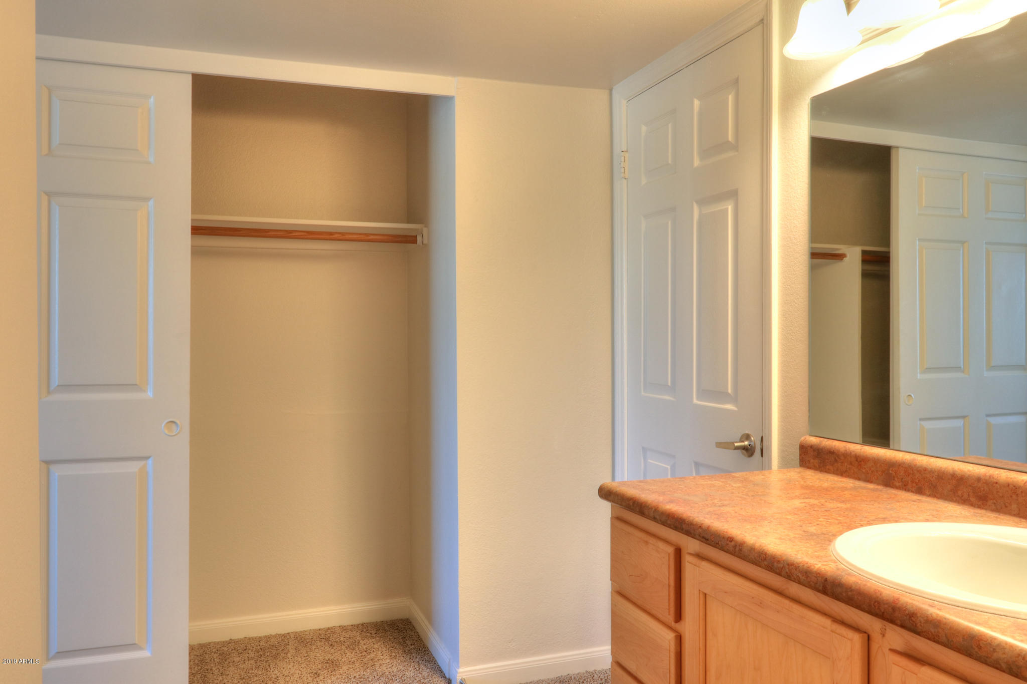 8256 East Arabian Trail, Unit 237 Scottsdale, AZ 85258 - Photo 22 of 31 a bathroom with a sink and a mirror