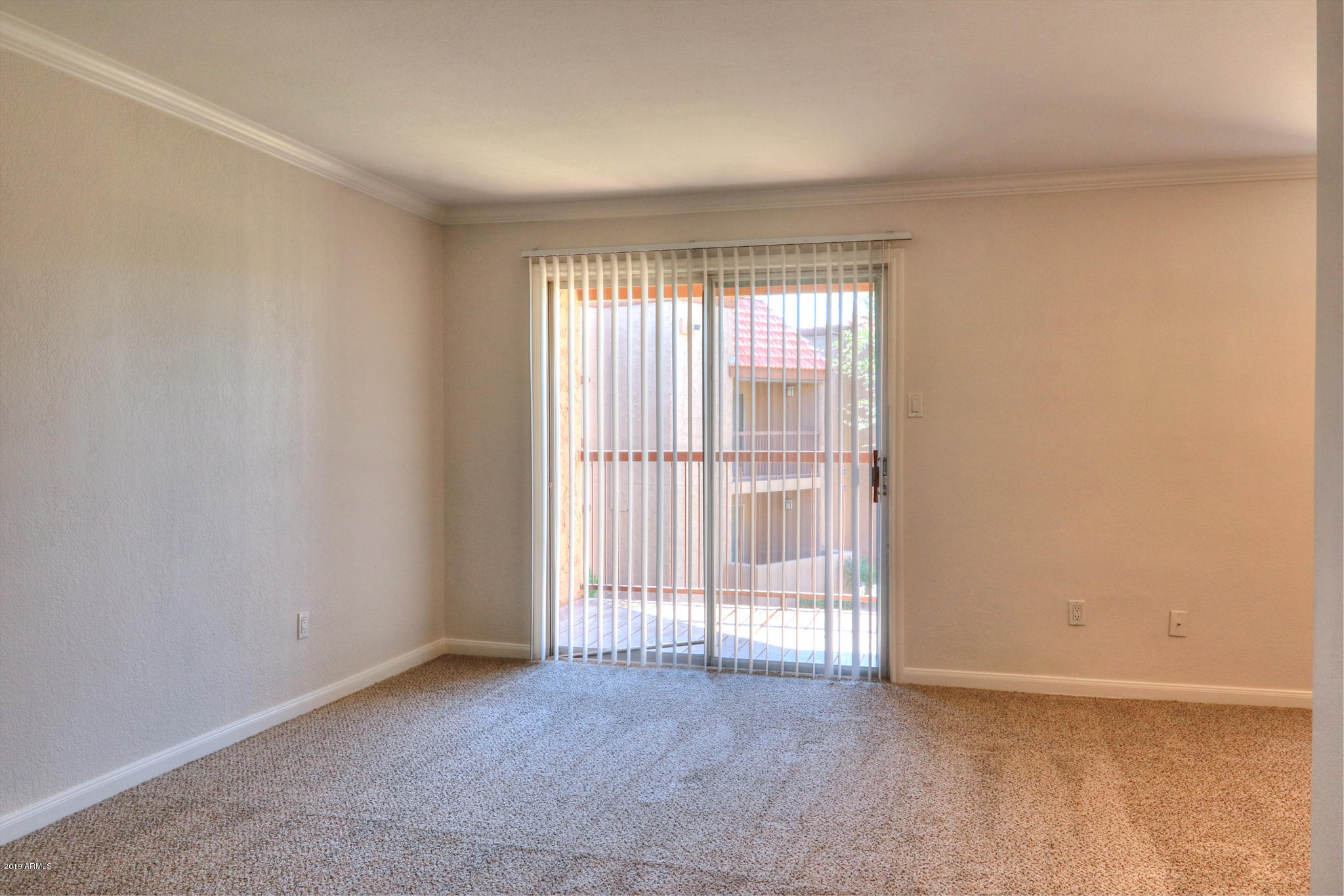 8256 East Arabian Trail, Unit 237 Scottsdale, AZ 85258 - Photo 5 of 31 an empty room with windows