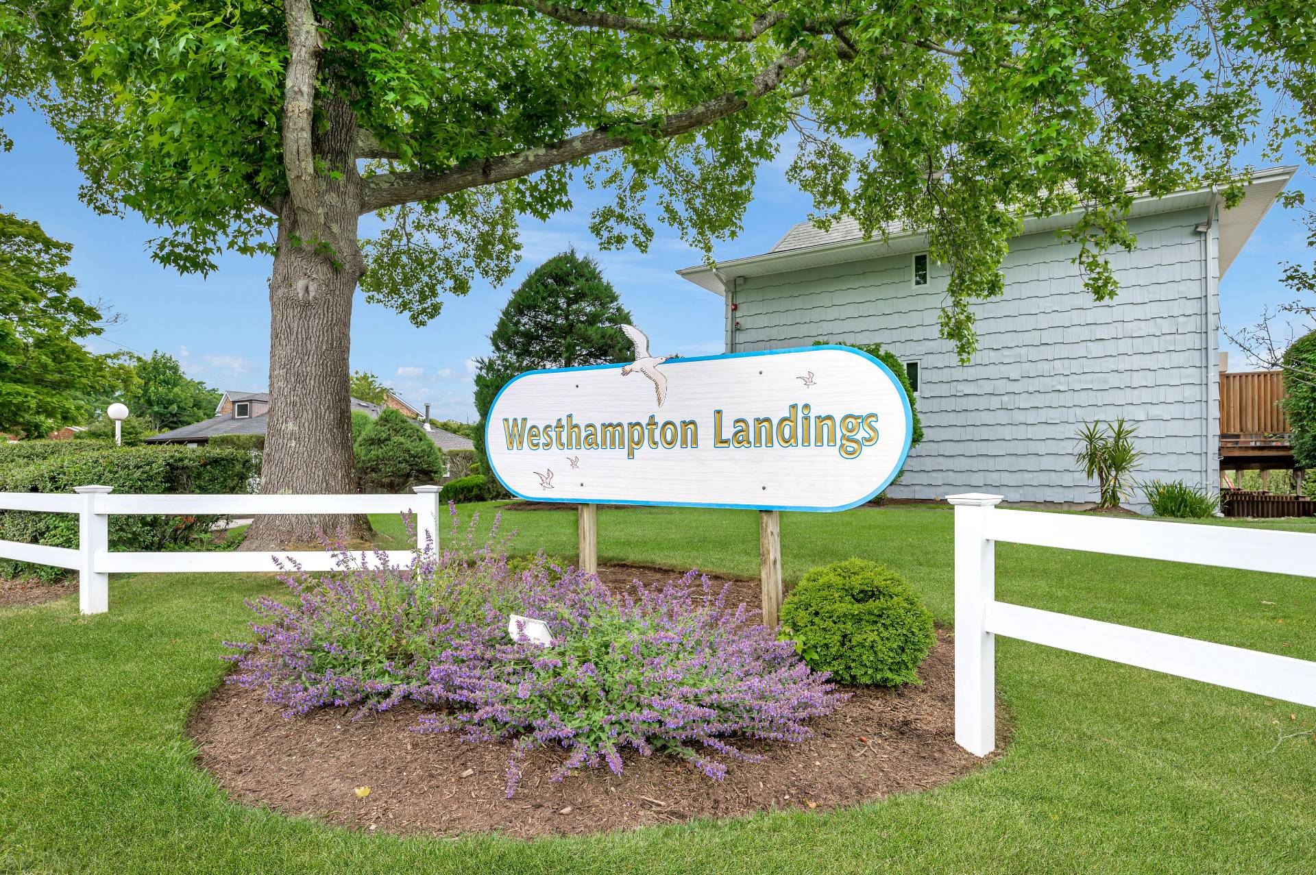 3004 Mitchell Road Westhampton Beach, NY 11978 - Photo 3 of 24 a sign on the side of the building