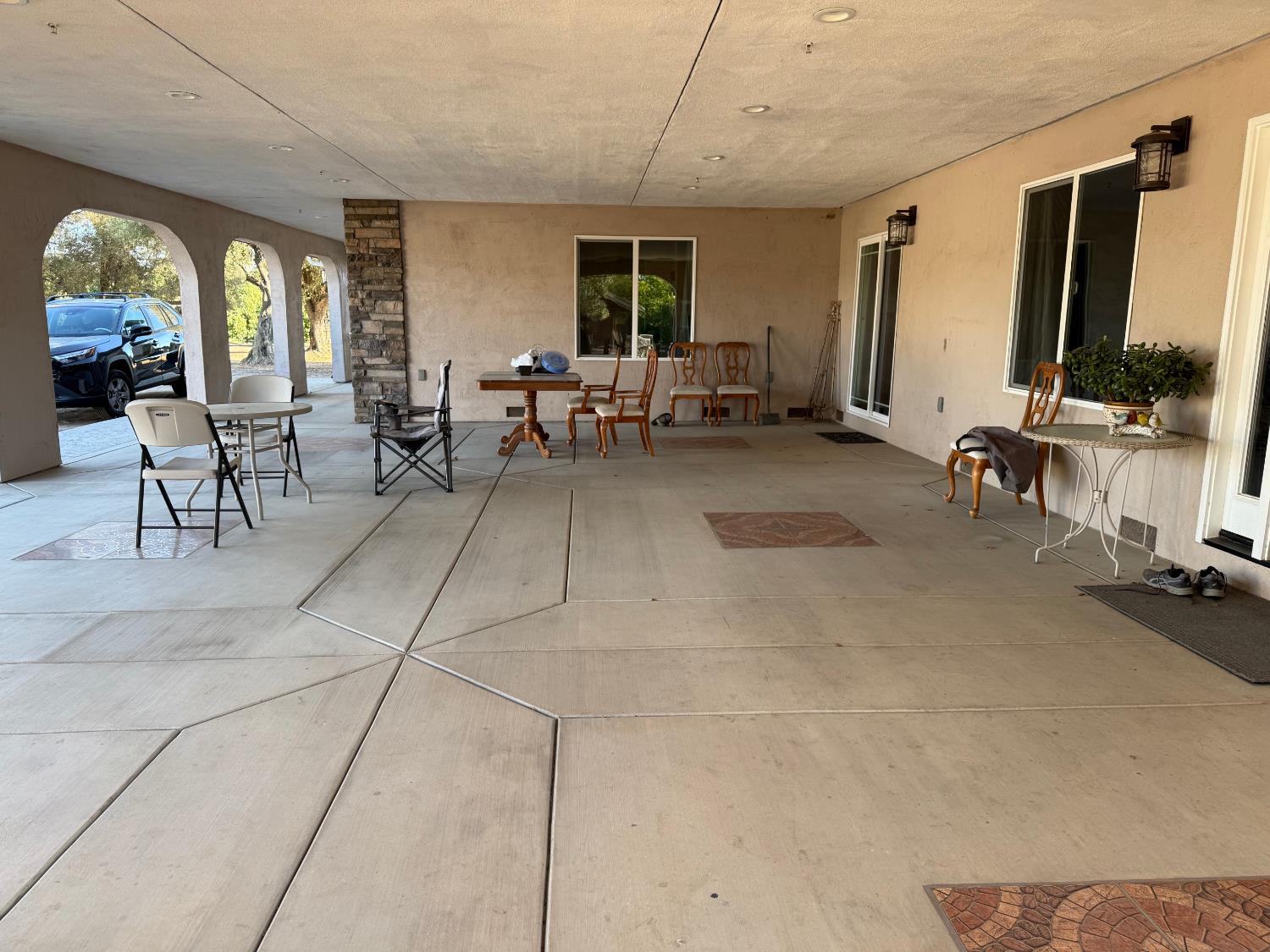 6731 River Road Oakdale, CA 95361 - Photo 4 of 39 Both east side entries are under the 1100 sq ft family gathering fully finished party porch with fire suppression sprinklers.