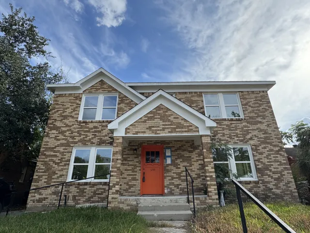 a front view of a house with garage