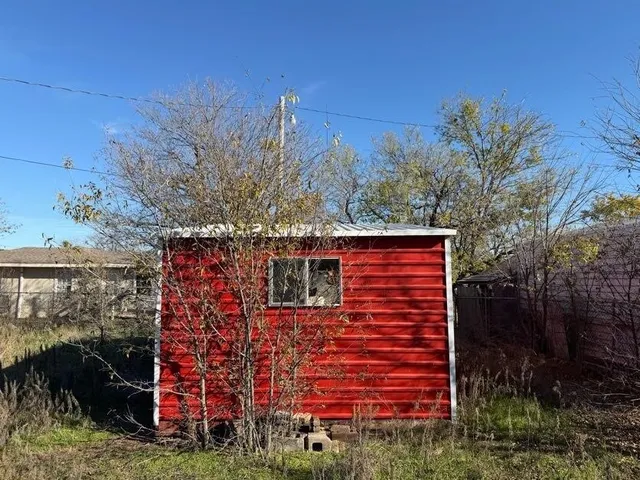 a view of a wooden door and an outdoor space