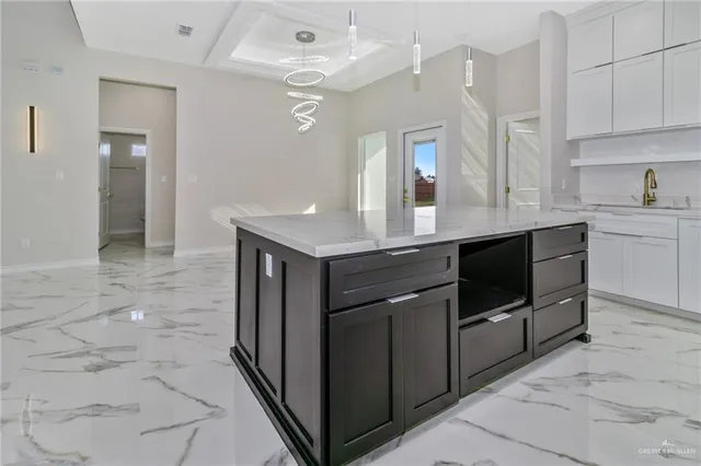 a kitchen with stainless steel appliances granite countertop a sink and cabinets