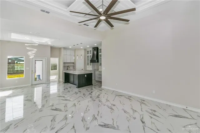 a view of a kitchen with a sink and cabinets