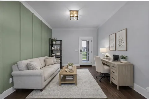 a view of a house with backyard water fountain and sitting area