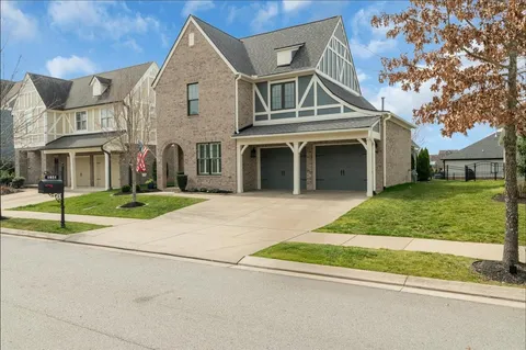 a kitchen with stainless steel appliances a refrigerator stove microwave and cabinets