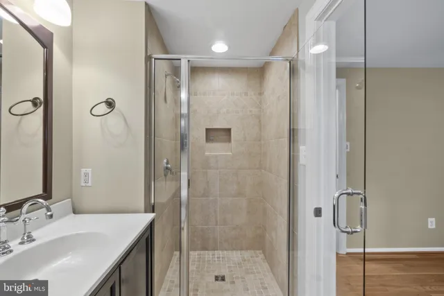 a bathroom with a shower and a sink