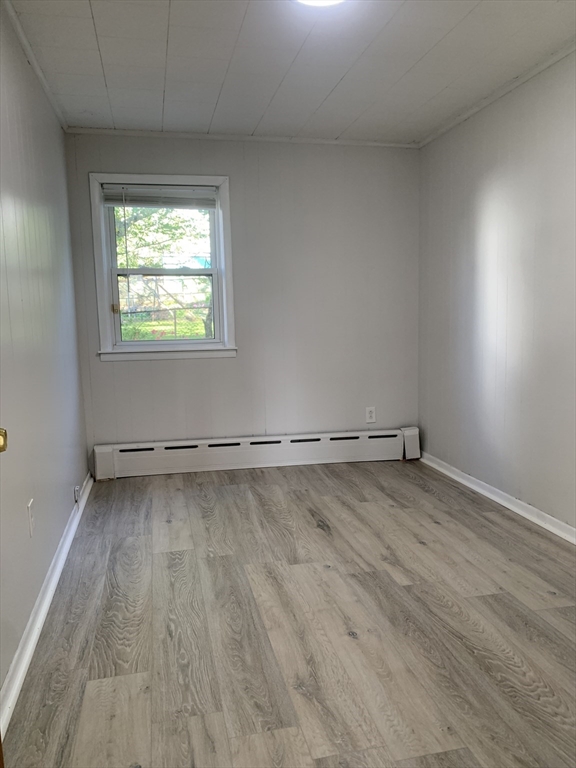 86 Hunter Street, Unit 2N Fall River, MA 02721 - Photo 4 of 4 a view of a room with wooden floor and window