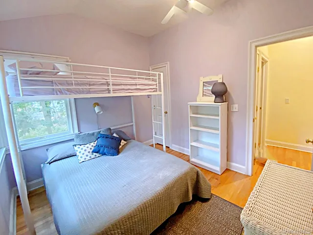 a bed room with a bed and a window