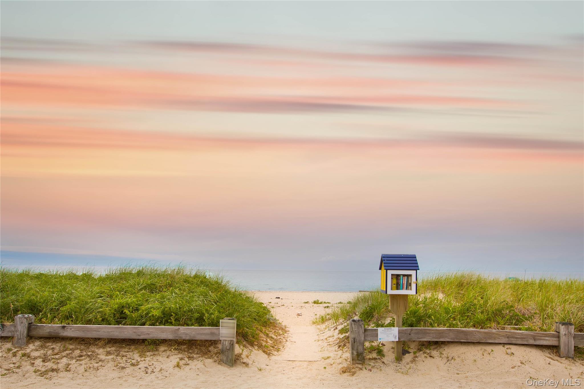 1855 Kenneys Road Southold, NY 11971 - Photo 18 of 18 a front view of a house with a yard
