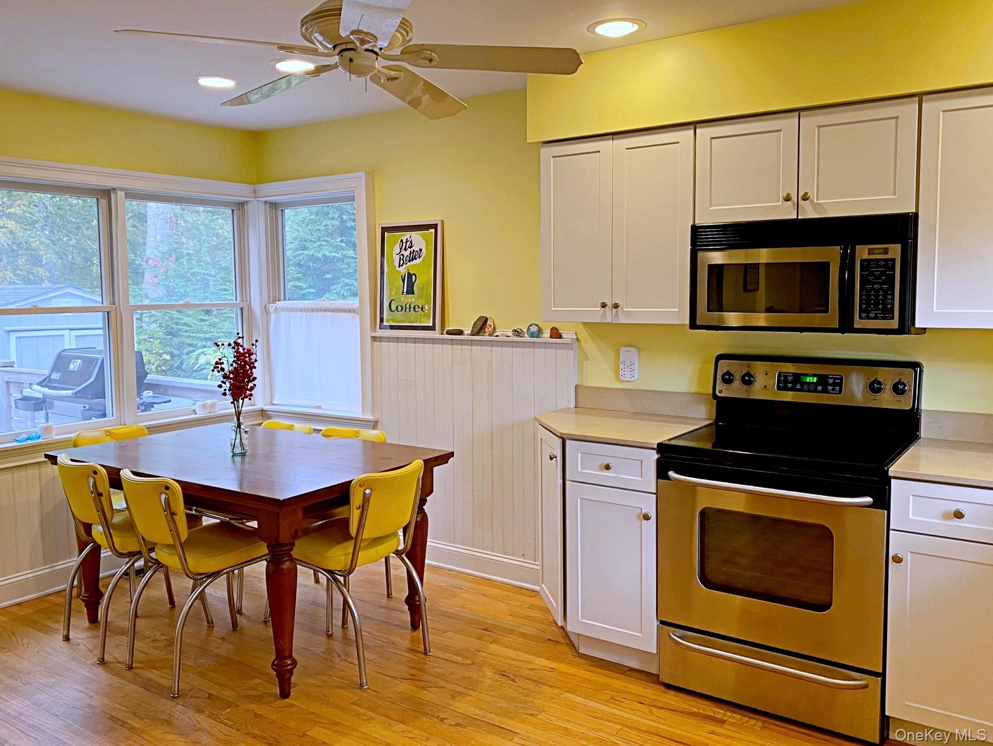 1855 Kenneys Road Southold, NY 11971 - Photo 5 of 18 a kitchen with a stove a sink and a microwave