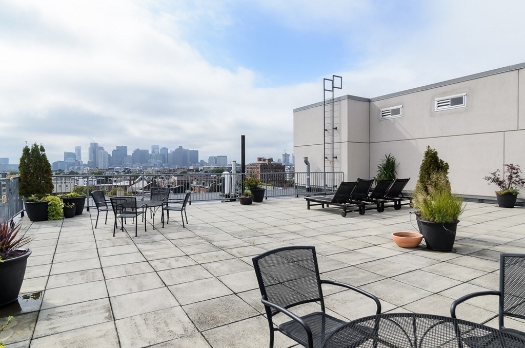 156 Porter Street, Unit 249 Boston, MA 02128 - Photo 20 of 30 a view of a terrace with furniture