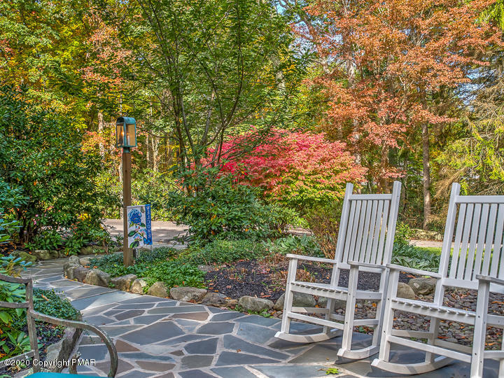 360 Babbling Brook Road Scotrun, PA 18355 - Photo 54 of 71 a view of an chairs and table in the backyard