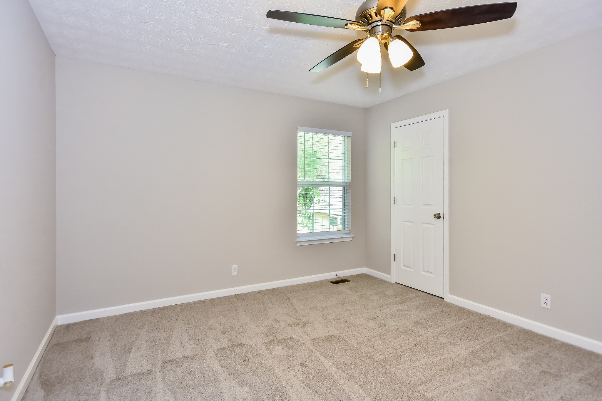 649 Laramie Drive Springfield, TN 37172 - Photo 13 of 15 an empty room with closet and a chandelier fan