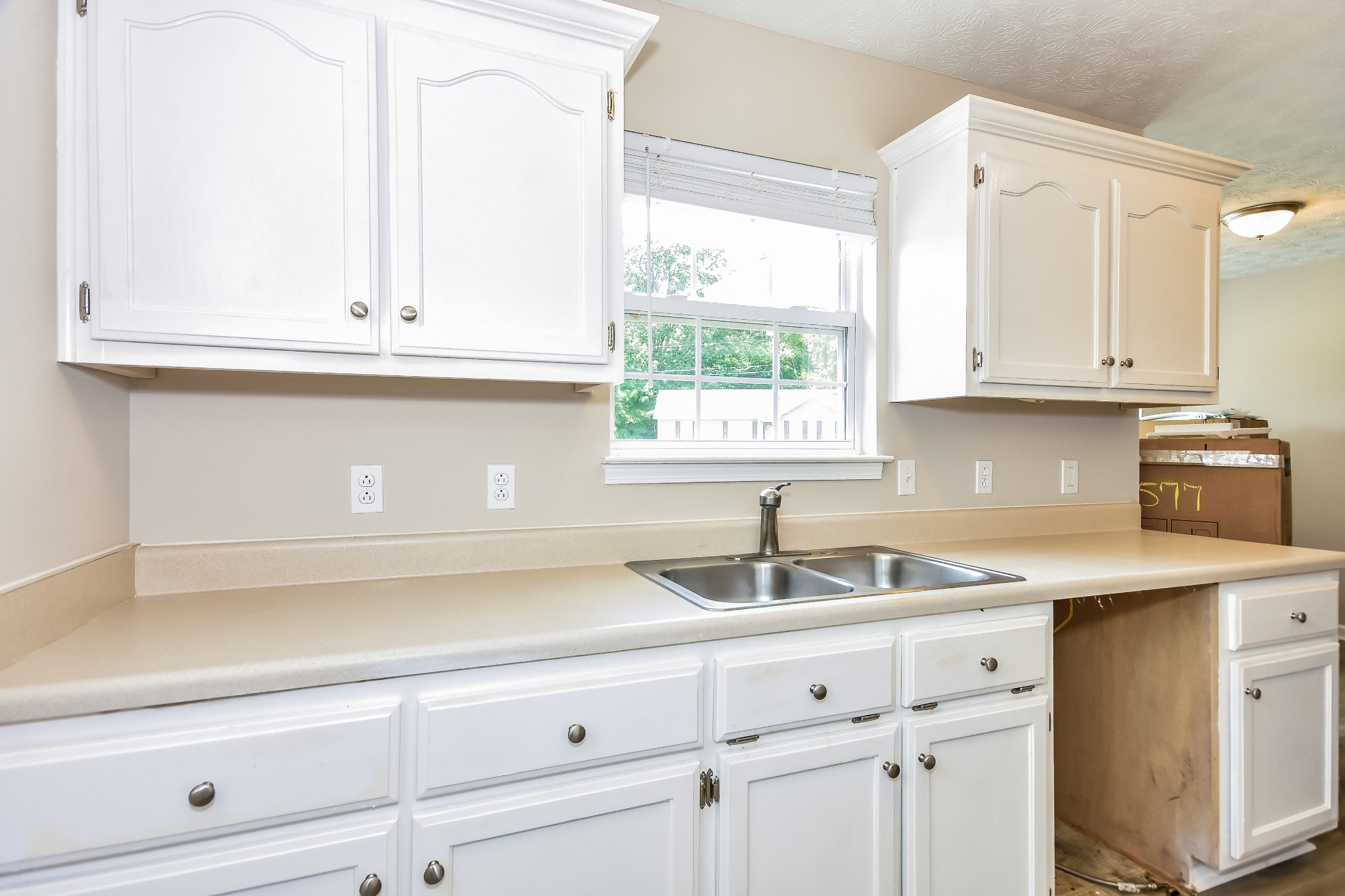 649 Laramie Drive Springfield, TN 37172 - Photo 4 of 15 a kitchen with granite countertop white cabinets and a sink
