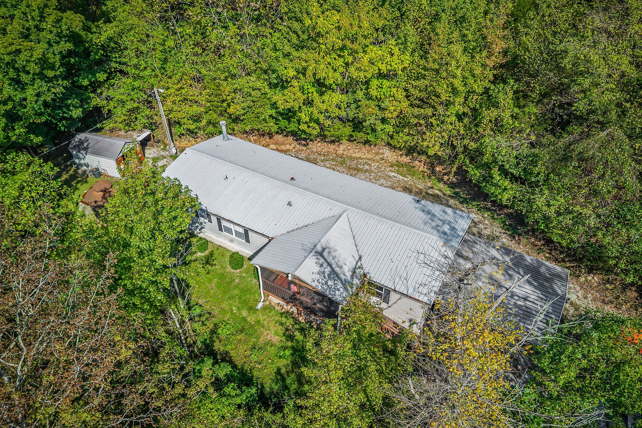 43 Moss Bend Road Lancaster, TN 38569 - Photo 13 of 75 an aerial view of a house with a yard and trees all around
