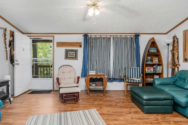 a view of kitchen with furniture and large window