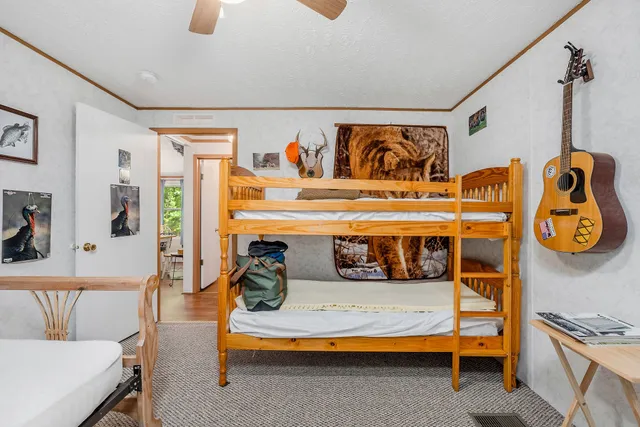 a spacious bathroom with a granite countertop sink and a mirror