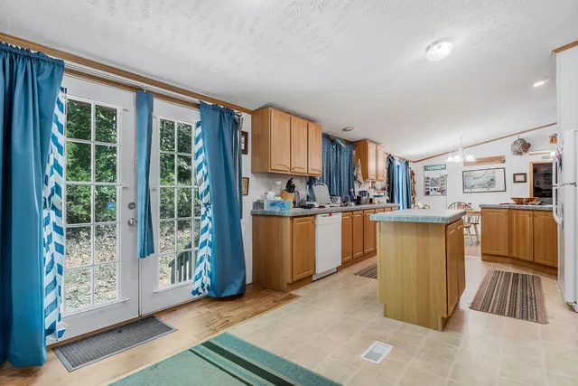 a view of a house with a porch and furniture