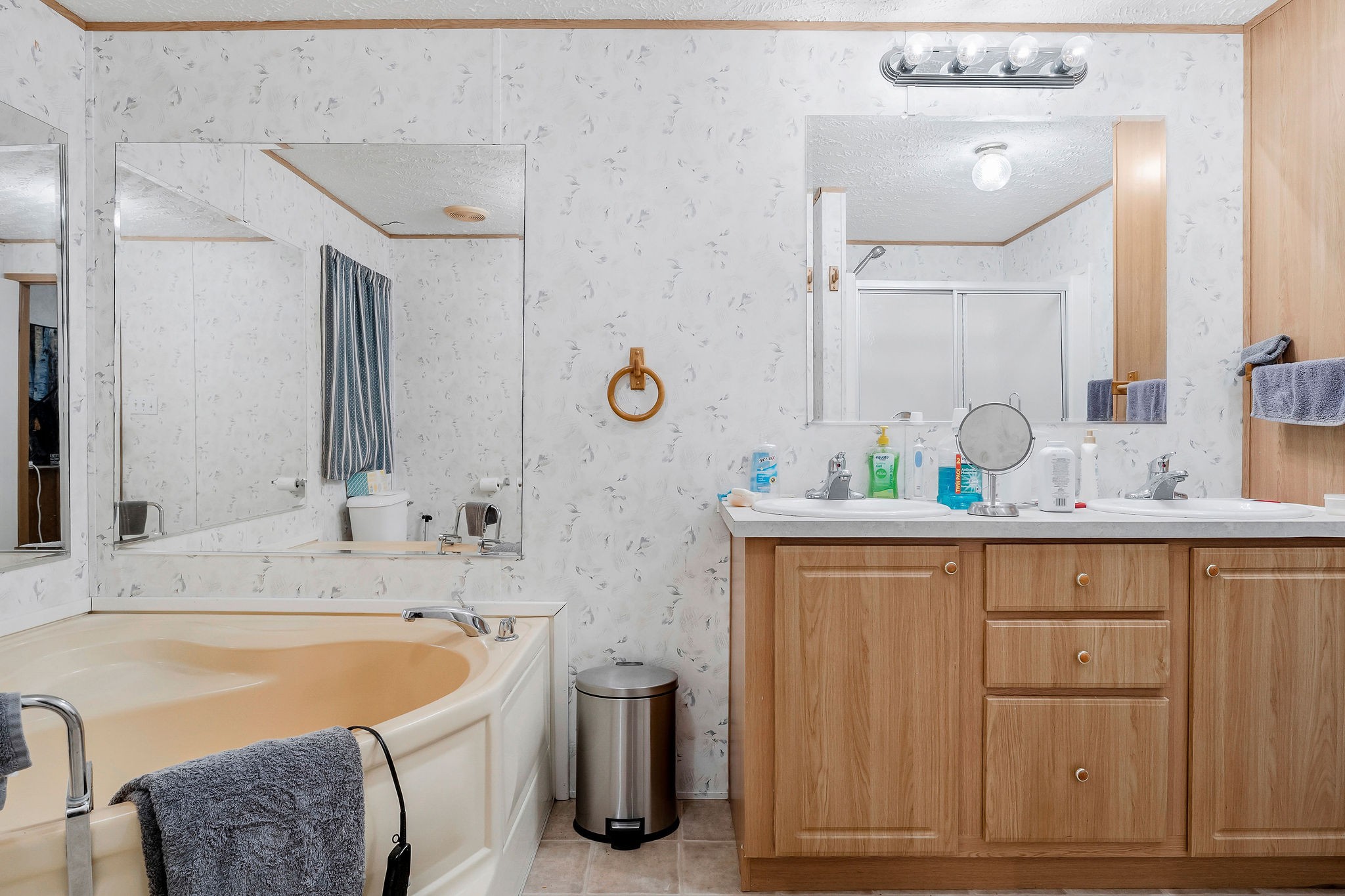 43 Moss Bend Road Lancaster, TN 38569 - Photo 37 of 75 a bathroom with a tub sink and mirror