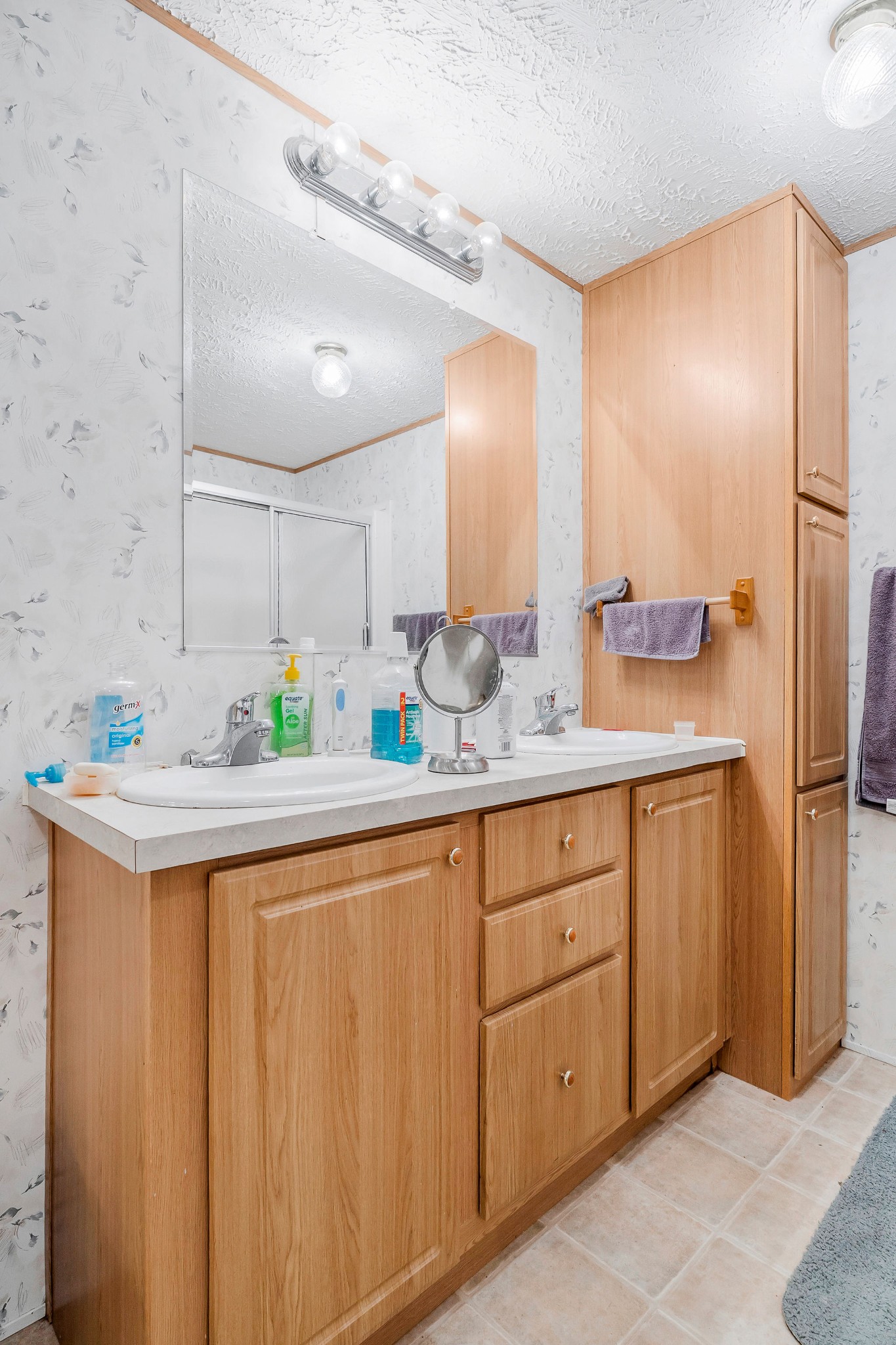 43 Moss Bend Road Lancaster, TN 38569 - Photo 38 of 75 a spacious bathroom with a granite countertop sink and a mirror