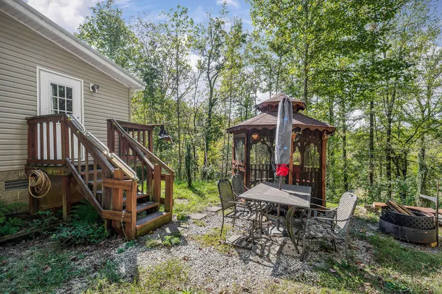 a view of outdoor space with deck and yard