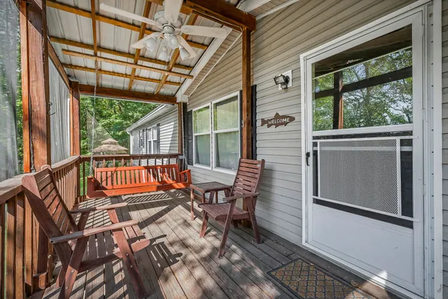 a backyard of a house with lots of green space and a fountain