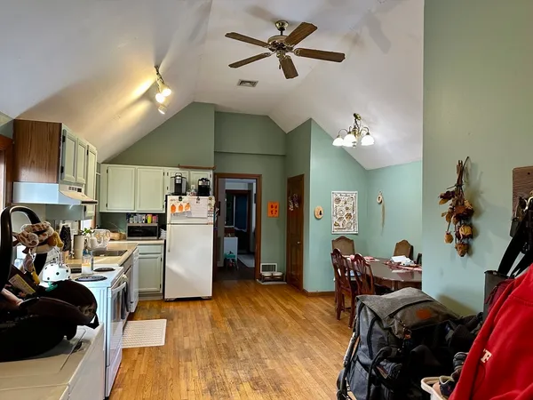 a view of a kitchen with workspace and a window