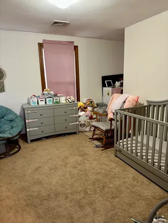 a bed room with furniture and a window